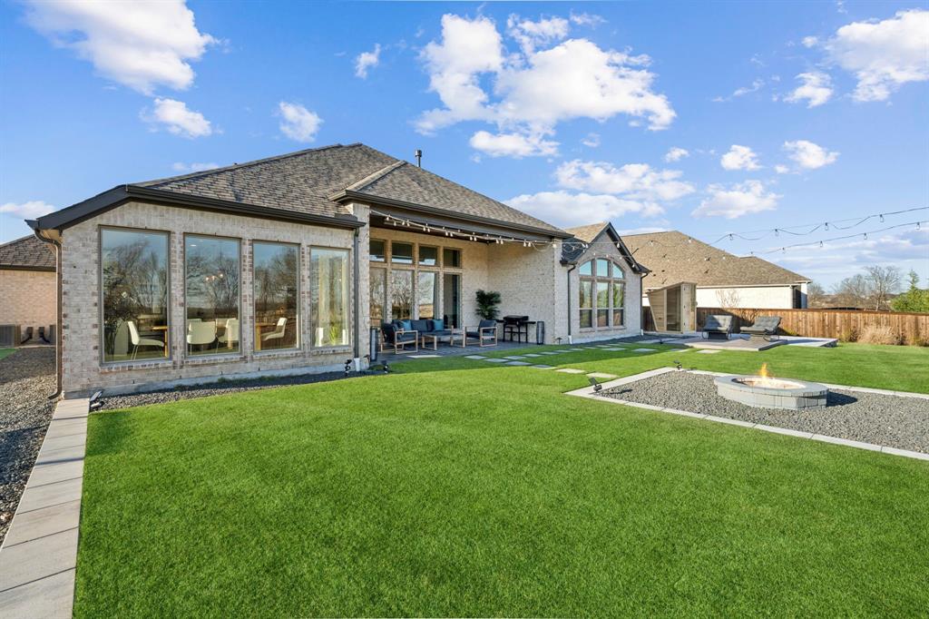 1551 Ripasso Way McLendon-Chisholm, TX 75032 - Photo 21 of 39 a view of an house with backyard porch and garden