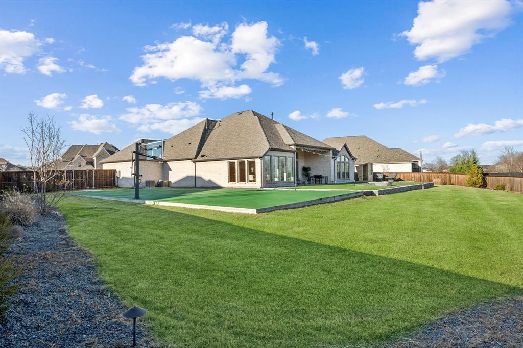 1551 Ripasso Way McLendon-Chisholm, TX 75032 - Photo 24 of 39 a view of an house with backyard and entertaining space
