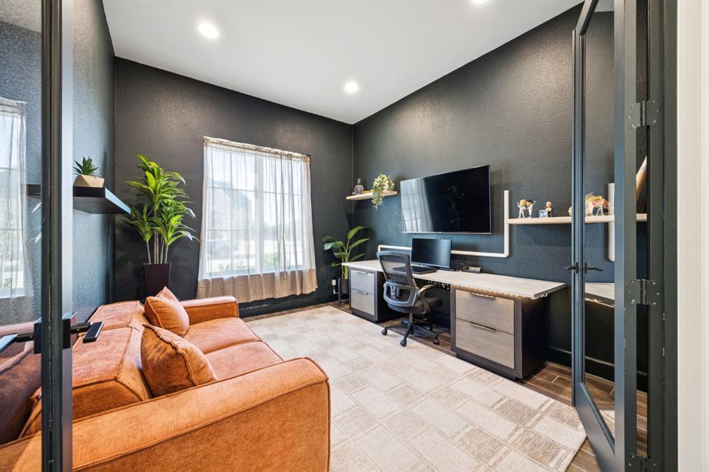 1551 Ripasso Way McLendon-Chisholm, TX 75032 - Photo 26 of 39 a living room with furniture and a flat screen tv