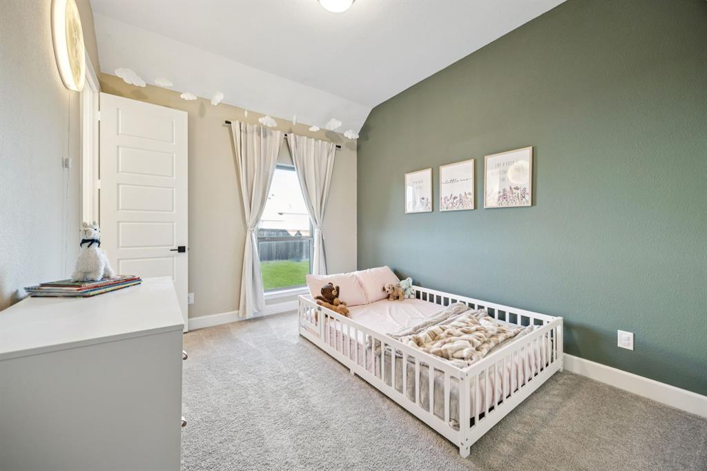 1551 Ripasso Way McLendon-Chisholm, TX 75032 - Photo 27 of 39 a bedroom with bed and a window