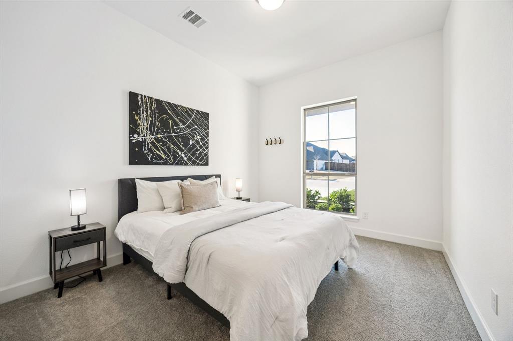 1551 Ripasso Way McLendon-Chisholm, TX 75032 - Photo 30 of 39 a bedroom with a bed and a window