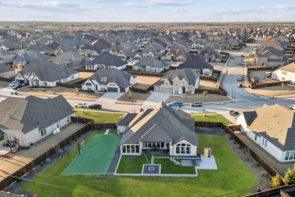 1551 Ripasso Way McLendon-Chisholm, TX 75032 - Photo 3 of 39 an aerial view of a house with swimming pool