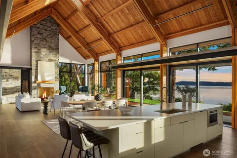 a very nice looking room with a large window and furniture