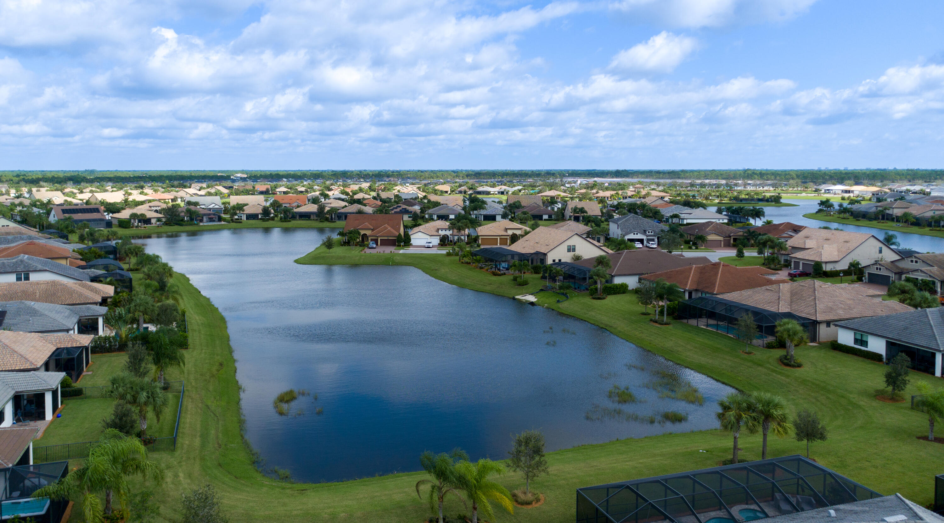 739 Southeast Villandry Way Port St. Lucie, FL 34984 - Photo 13 of 51 a view of a lake with a city