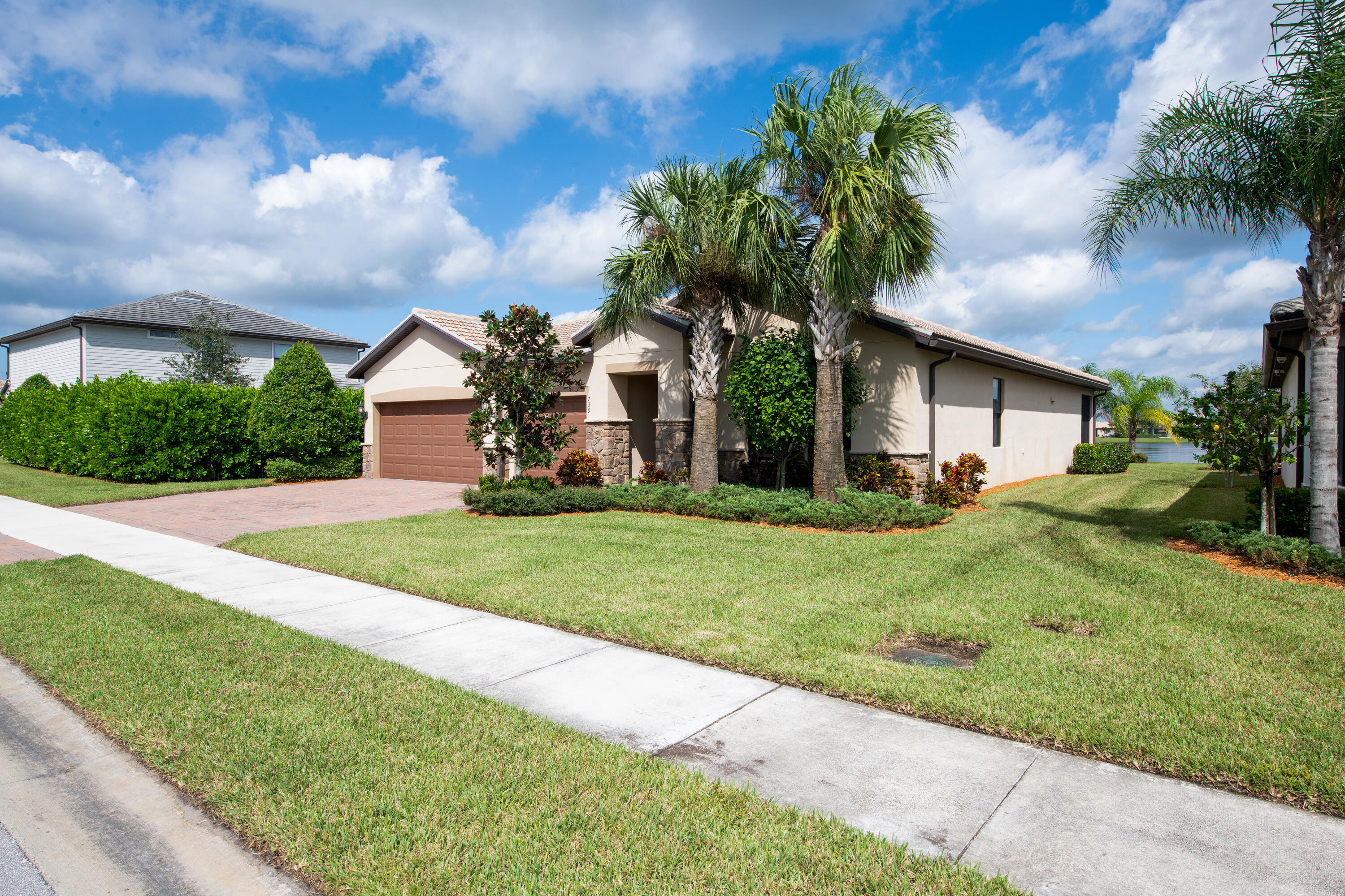 739 Southeast Villandry Way Port St. Lucie, FL 34984 - Photo 18 of 51 a front view of house with yard and green space