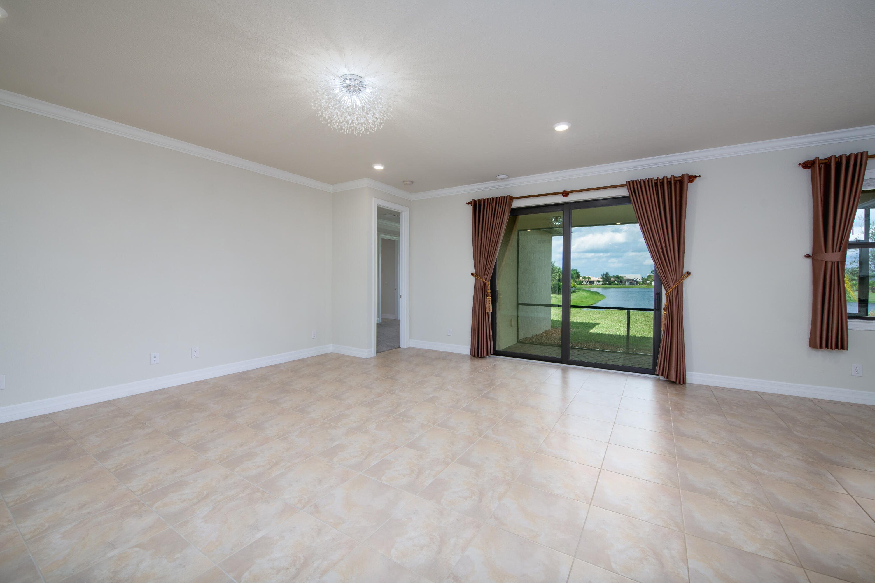 739 Southeast Villandry Way Port St. Lucie, FL 34984 - Photo 26 of 51 an empty room with large windows and a shower