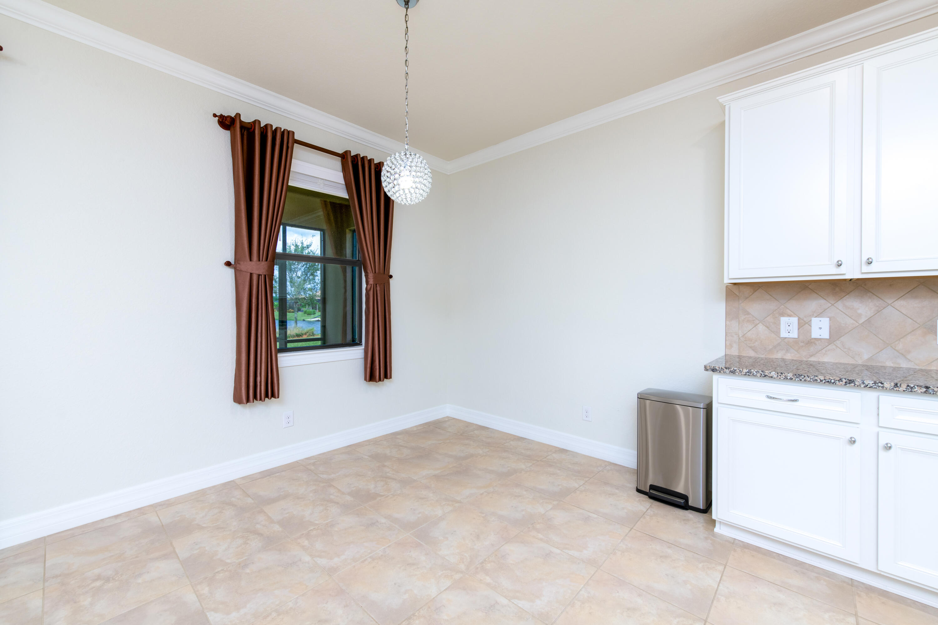 739 Southeast Villandry Way Port St. Lucie, FL 34984 - Photo 33 of 51 a view of an empty room with closet and a window