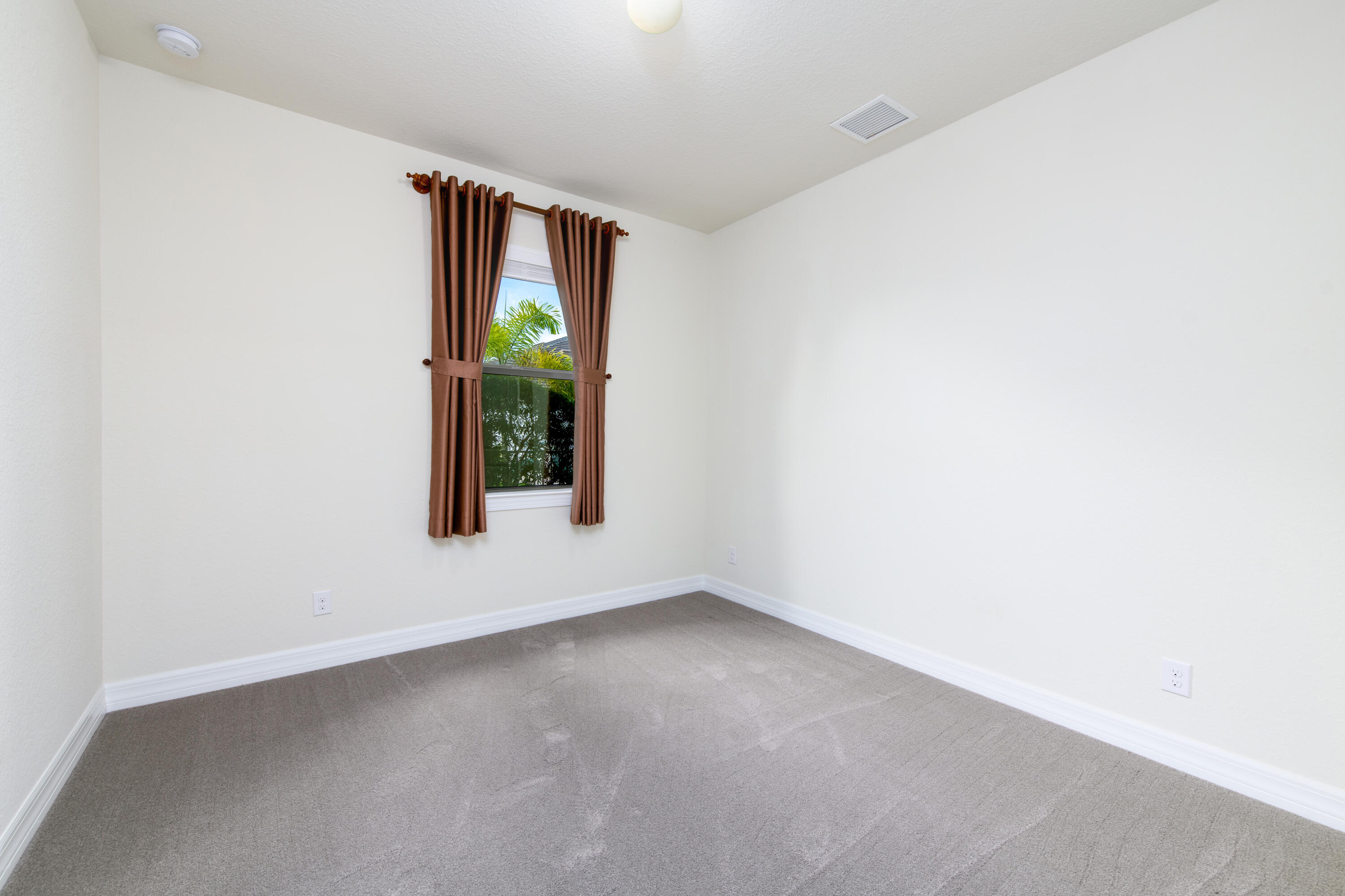 739 Southeast Villandry Way Port St. Lucie, FL 34984 - Photo 34 of 51 a view of an empty room with window