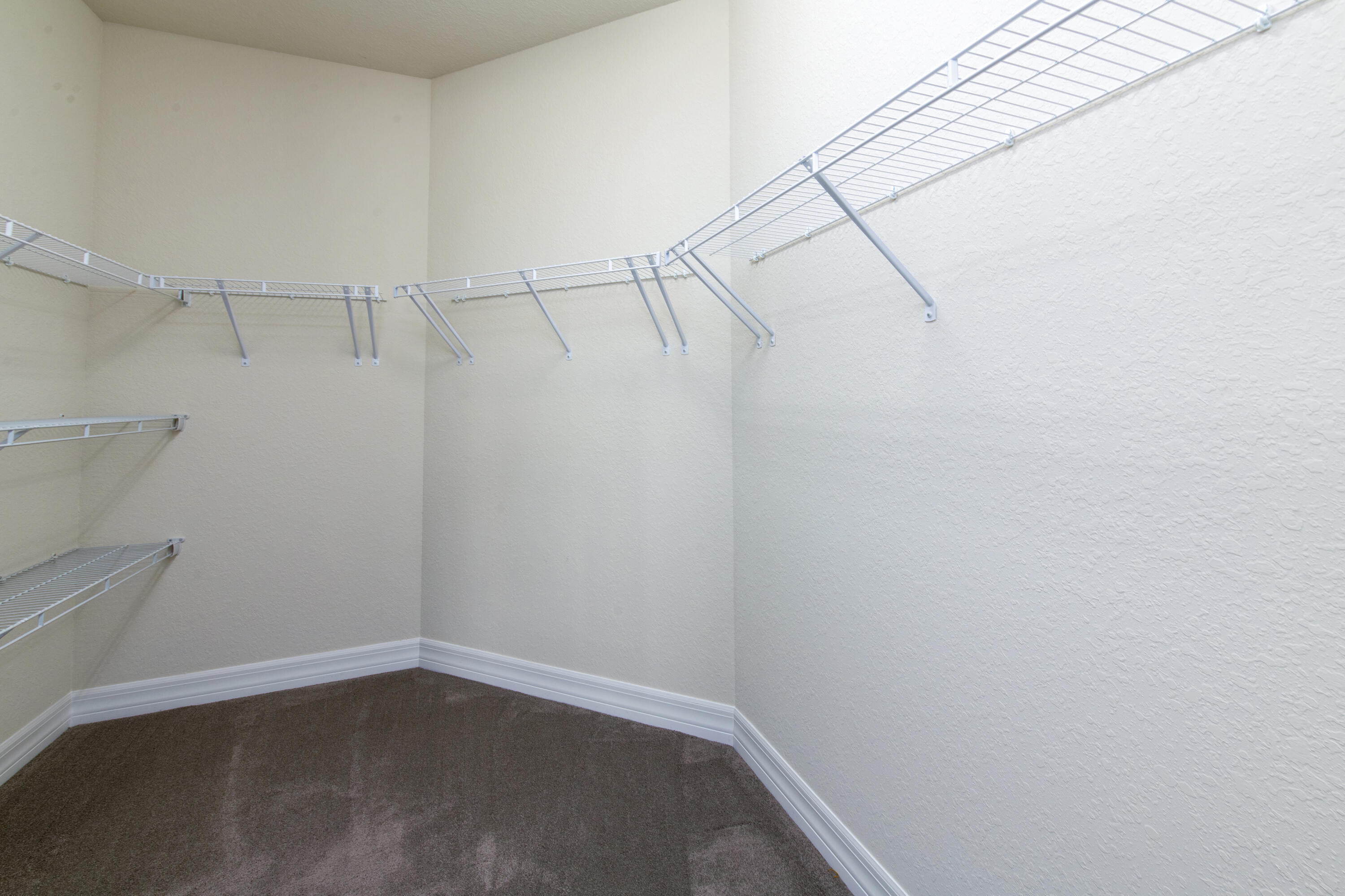 739 Southeast Villandry Way Port St. Lucie, FL 34984 - Photo 43 of 51 a view of a room with racks on the wall