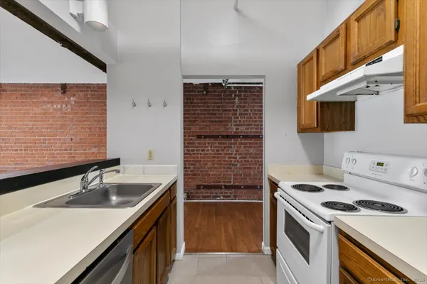 a kitchen that has a sink and a stove