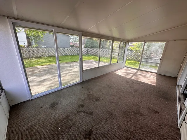 a view of empty room with front door