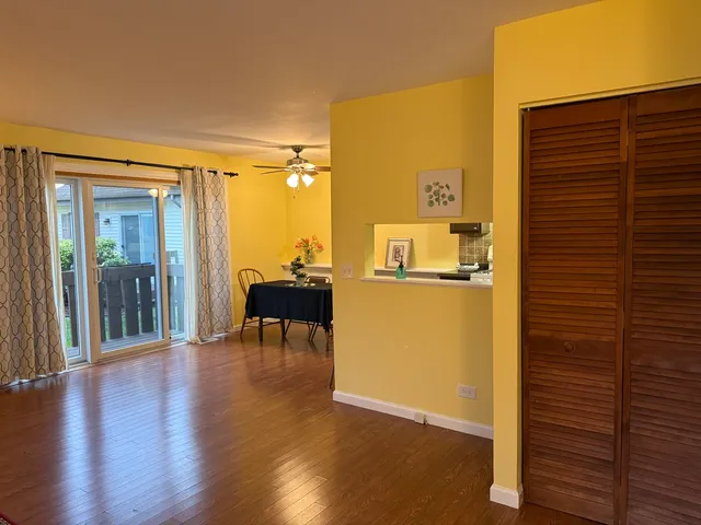 a view of a livingroom with furniture and a dinning room
