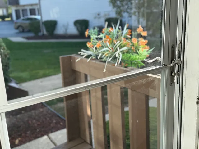 a view of a balcony with a potted plant