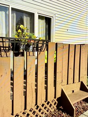 a front view of a house with large windows