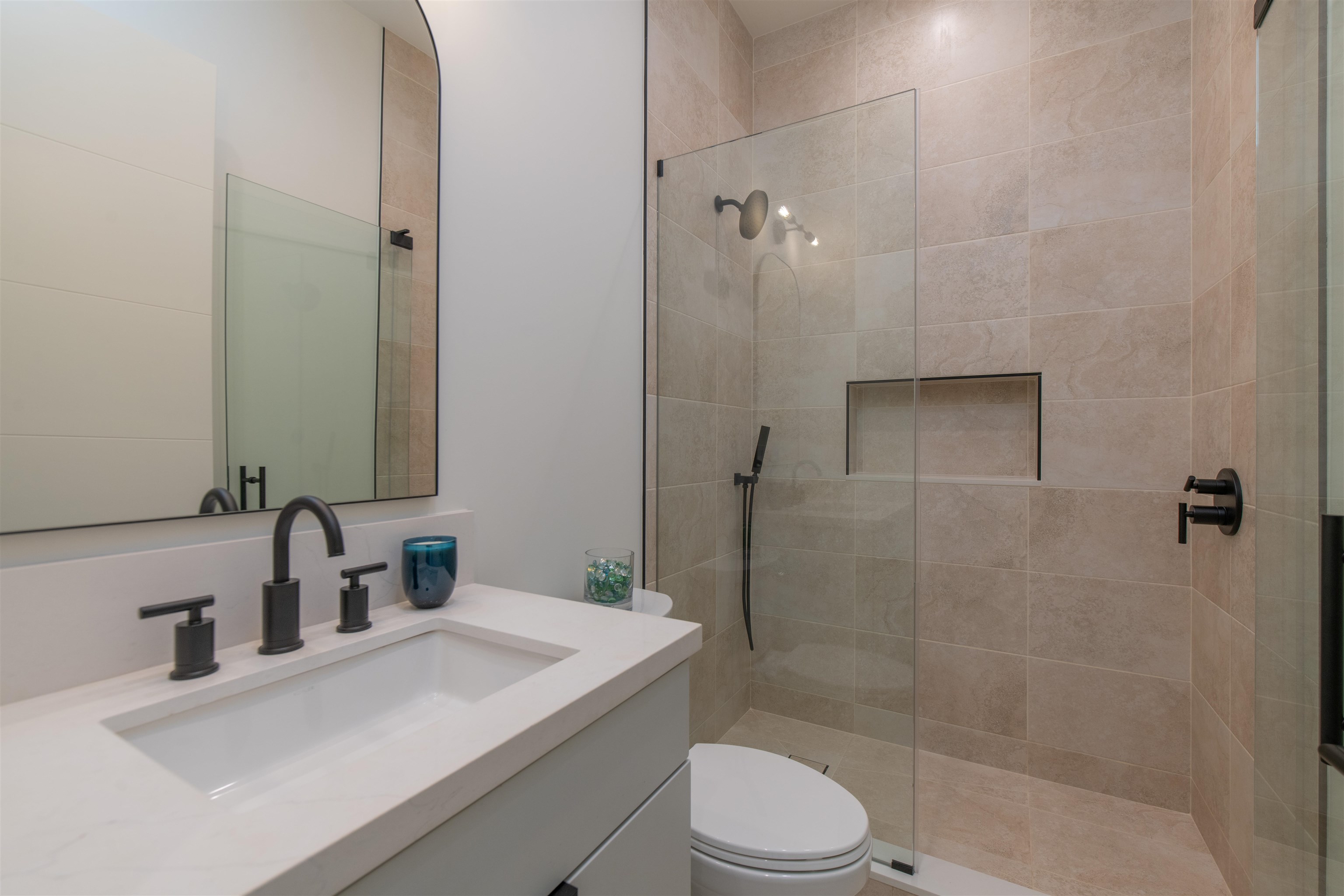 111 Mehana Road, Unit A Haiku, HI 96708 - Photo 38 of 50 a bathroom with a sink a toilet and shower