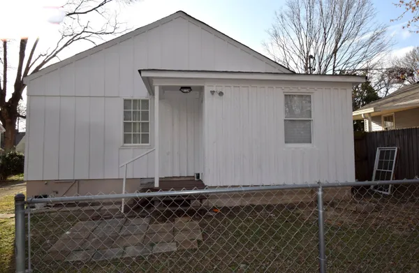 a house with trees in the background