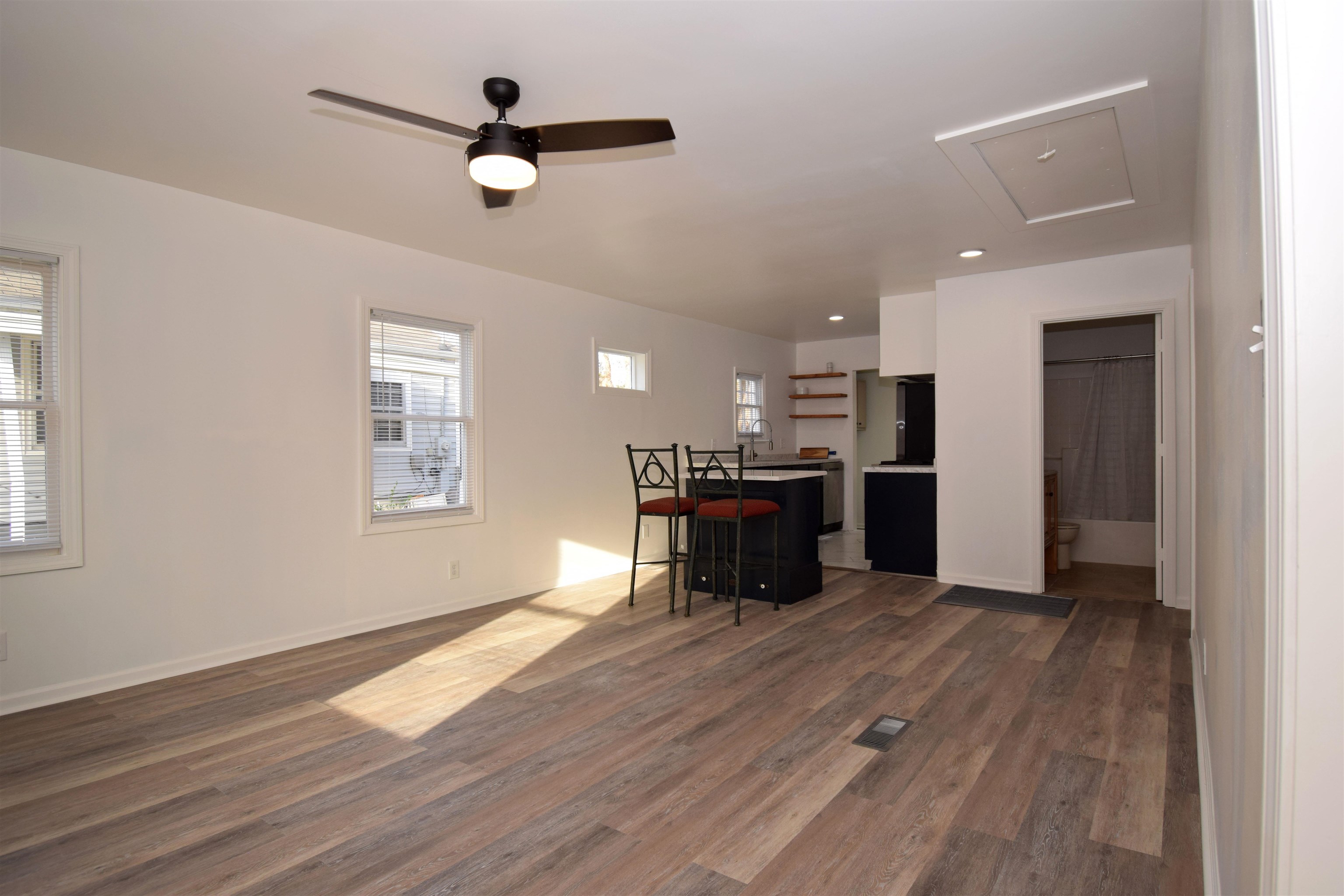 50 Webber Street Jackson, TN 38301 - Photo 9 of 13 a living room with hard wood floors and a kitchen