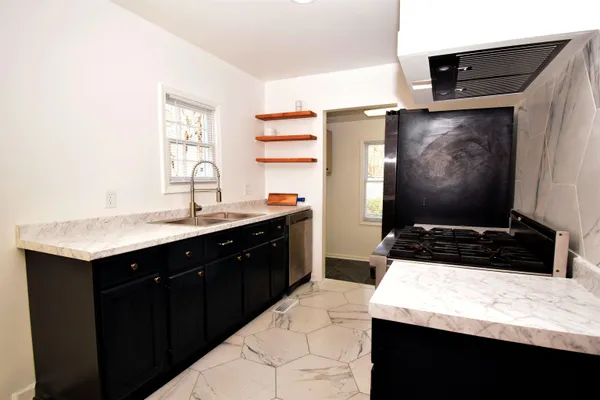 a room with a bed and a flat screen tv