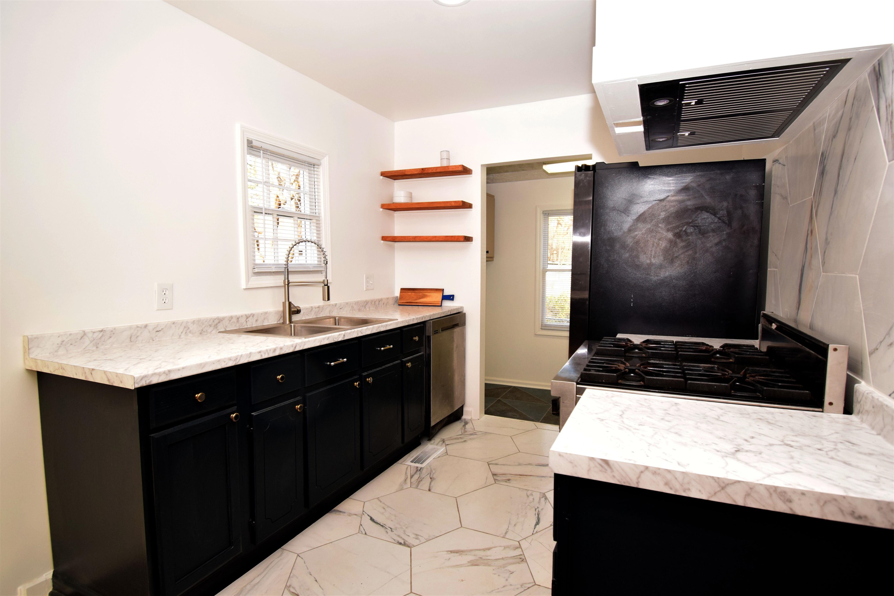 50 Webber Street Jackson, TN 38301 - Photo 10 of 13 a room with a bed and a flat screen tv