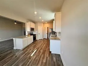 a view of kitchen with wooden floor