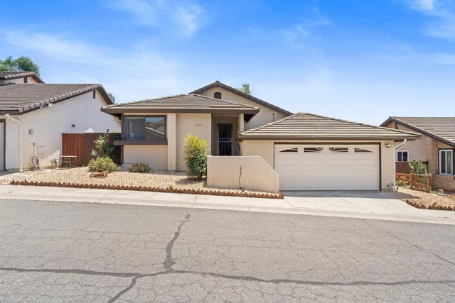 a front view of a house with a garage
