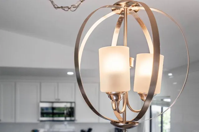 a view of a livingroom with furniture and staircase