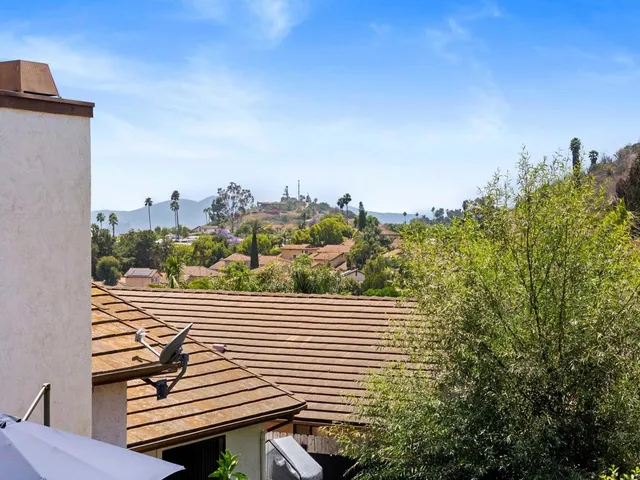 a view of a balcony with city view