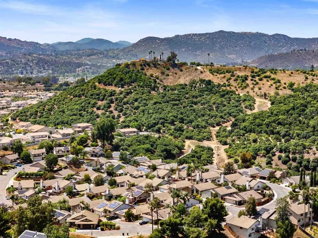 an aerial view of residential house and green space