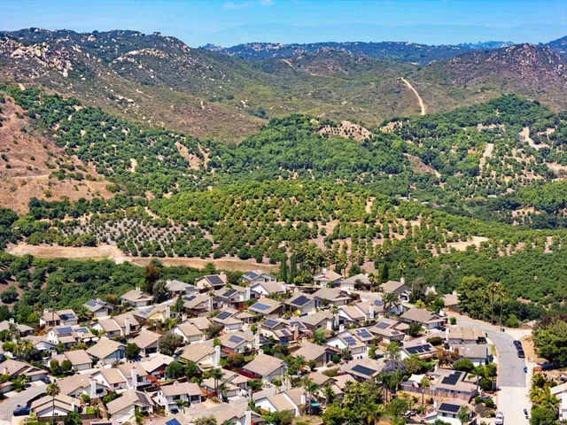 a view of a city with mountains in the background
