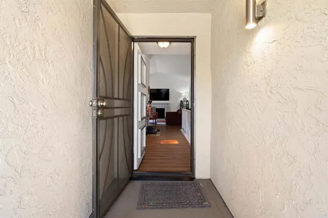 a view of a hallway with a room