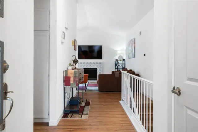 a view of a livingroom with furniture and a flat screen tv