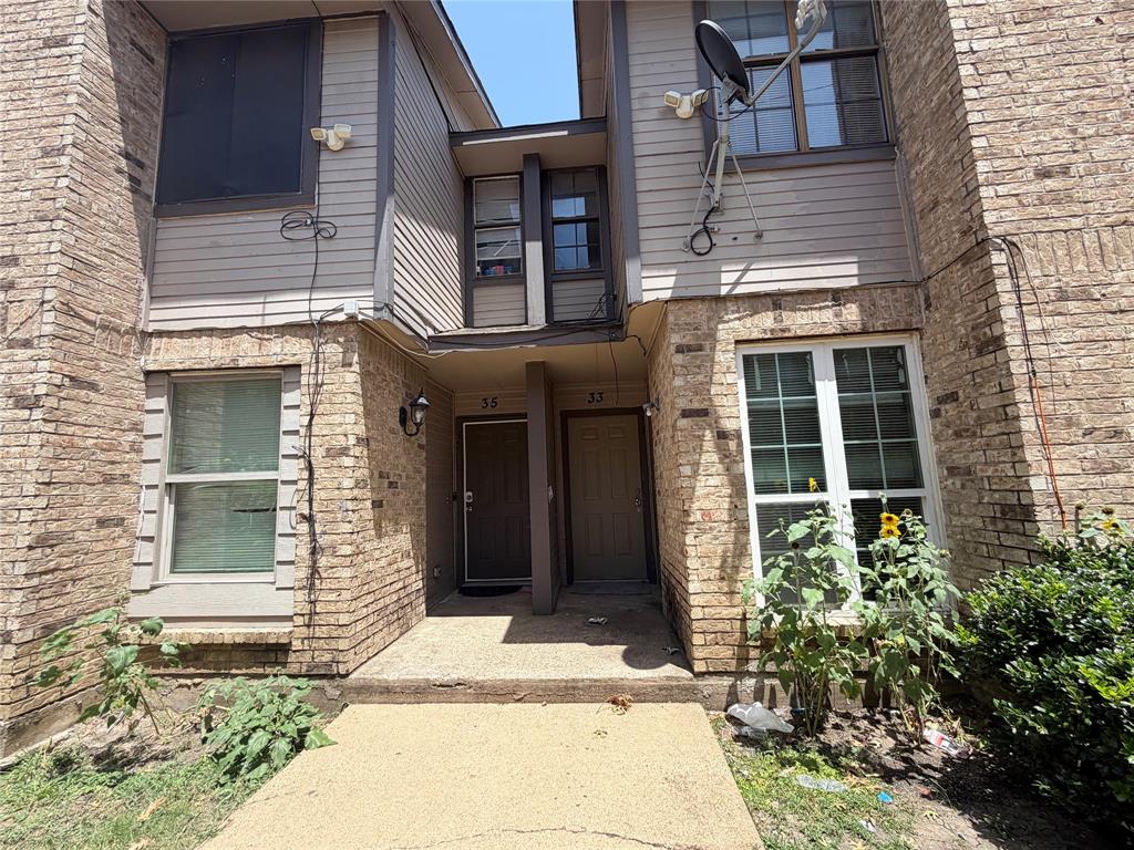 8001 Rothington Road, Unit 33 Dallas, TX 75227 - Photo 1 of 15 Brick and siding exterior with multiple windows