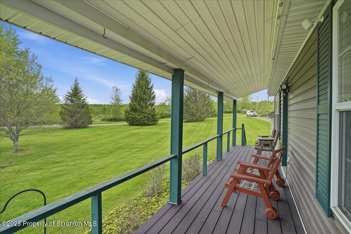 5231 Fiddle Lake Road Thompson, PA 18465 - Photo 7 of 34 a view of a balcony with yard