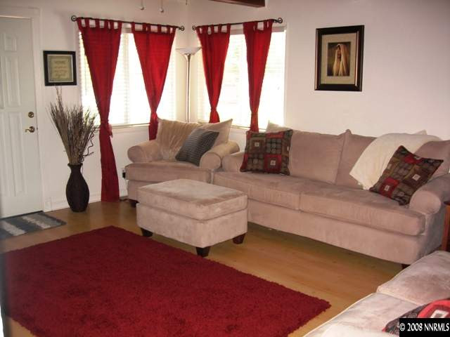 1745 Beech Street Reno, NV 89512 - Photo 3 of 9 a living room with furniture and a large window