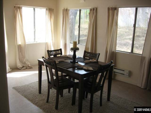 1745 Beech Street Reno, NV 89512 - Photo 4 of 9 a view of a dining room with furniture and window