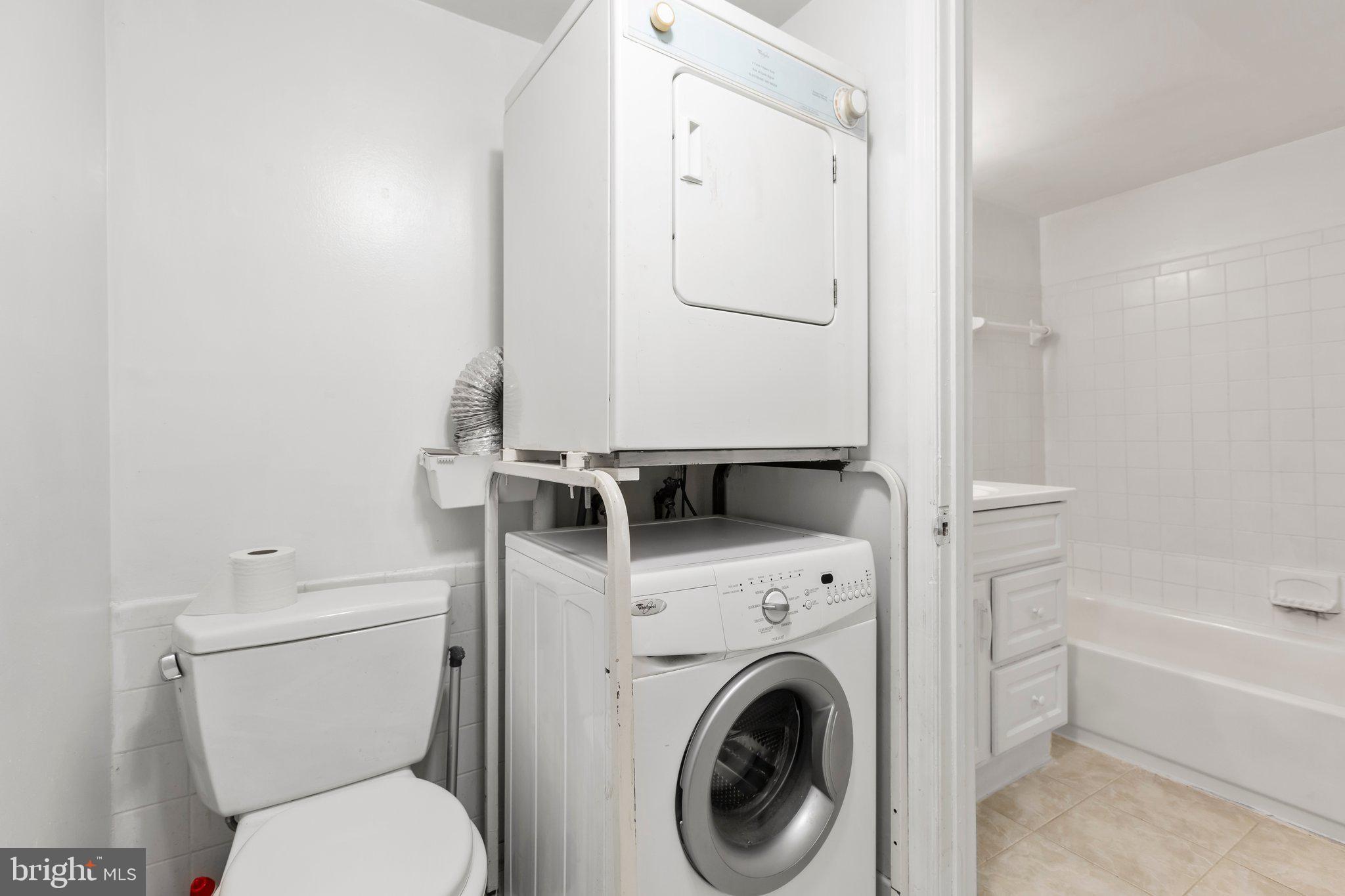 5902 Kingsford Road, Unit 406 Springfield, VA 22152 - Photo 23 of 41 Full Bathroom with stacked washer and dryer