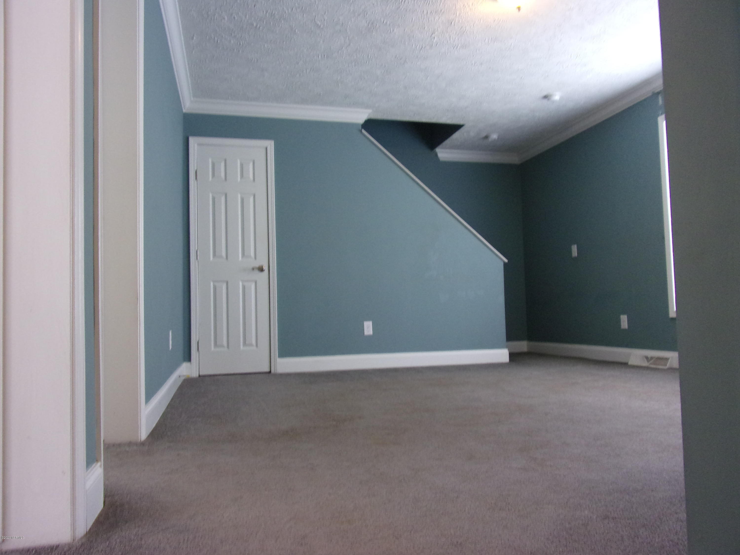 2568 Union Chapel Road Currie, NC 28435 - Photo 9 of 16 Den and stairs to Attic/Bonus Room.