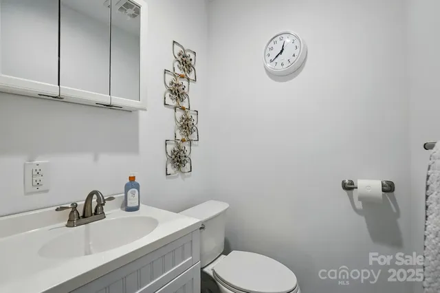 a room with patio furniture and a potted plant