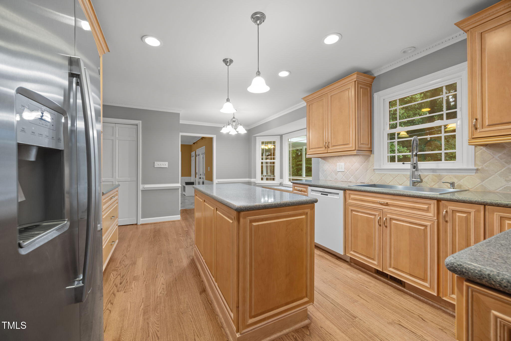2204 Corberrie Lane Raleigh, NC 27613 - Photo 10 of 39 a kitchen with stainless steel appliances granite countertop a sink a stove and refrigerator