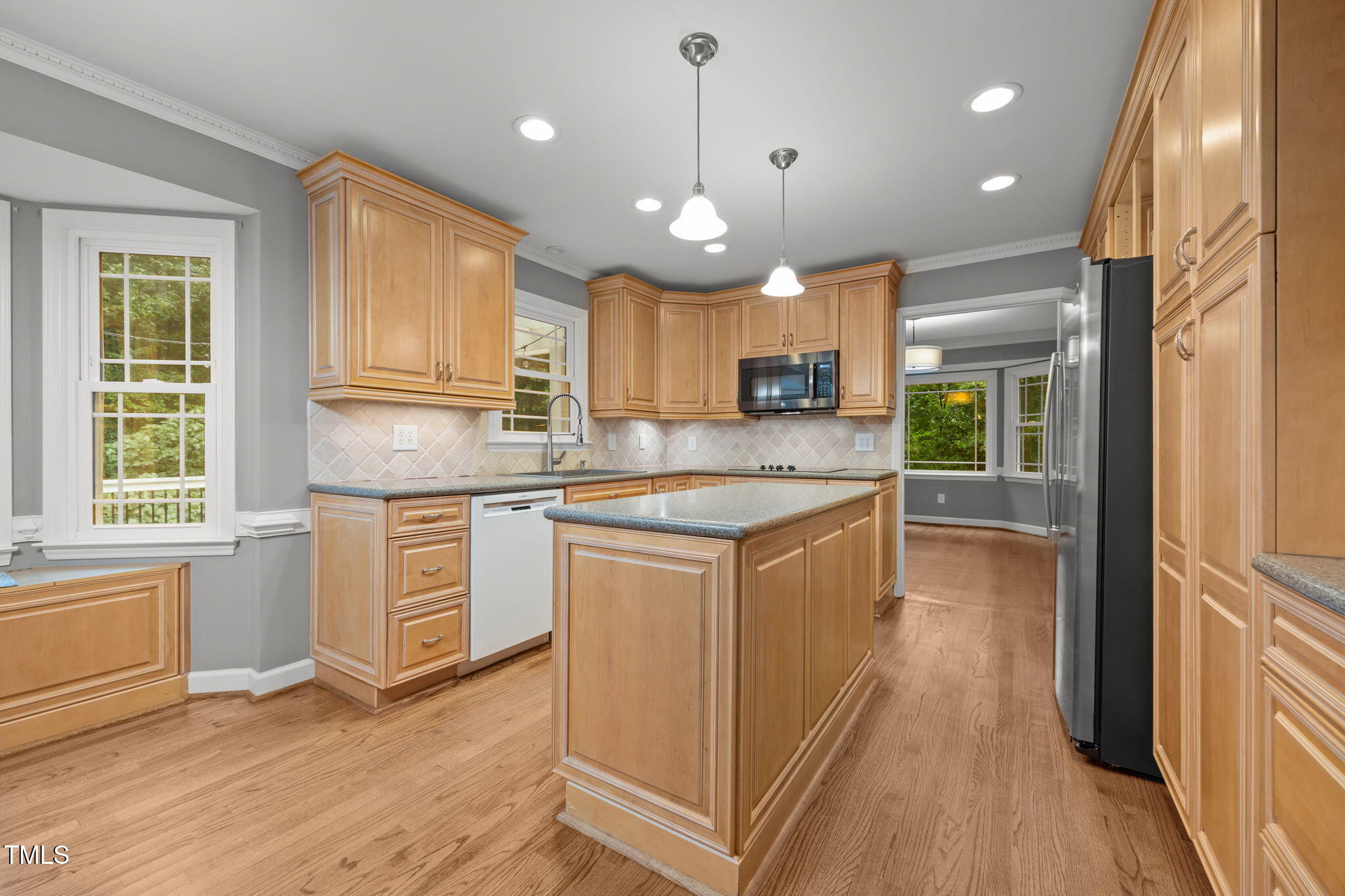 2204 Corberrie Lane Raleigh, NC 27613 - Photo 12 of 39 a kitchen with stainless steel appliances granite countertop a sink a stove and a refrigerator