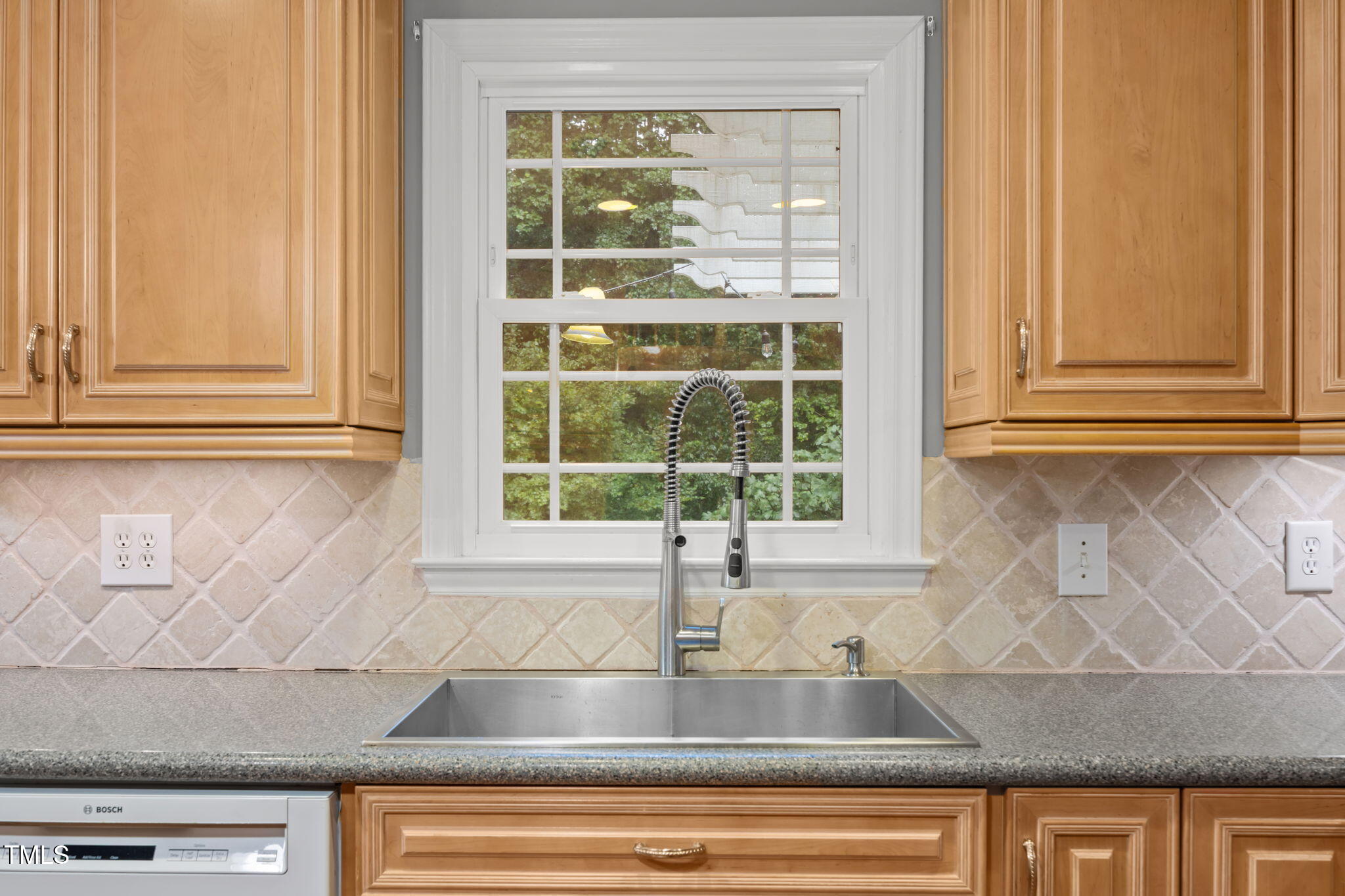 2204 Corberrie Lane Raleigh, NC 27613 - Photo 13 of 39 a kitchen with granite countertop a sink and a window