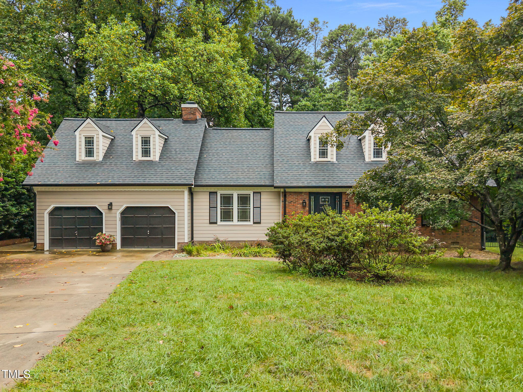 2204 Corberrie Lane Raleigh, NC 27613 - Photo 2 of 39 a front view of a house with yard and green space