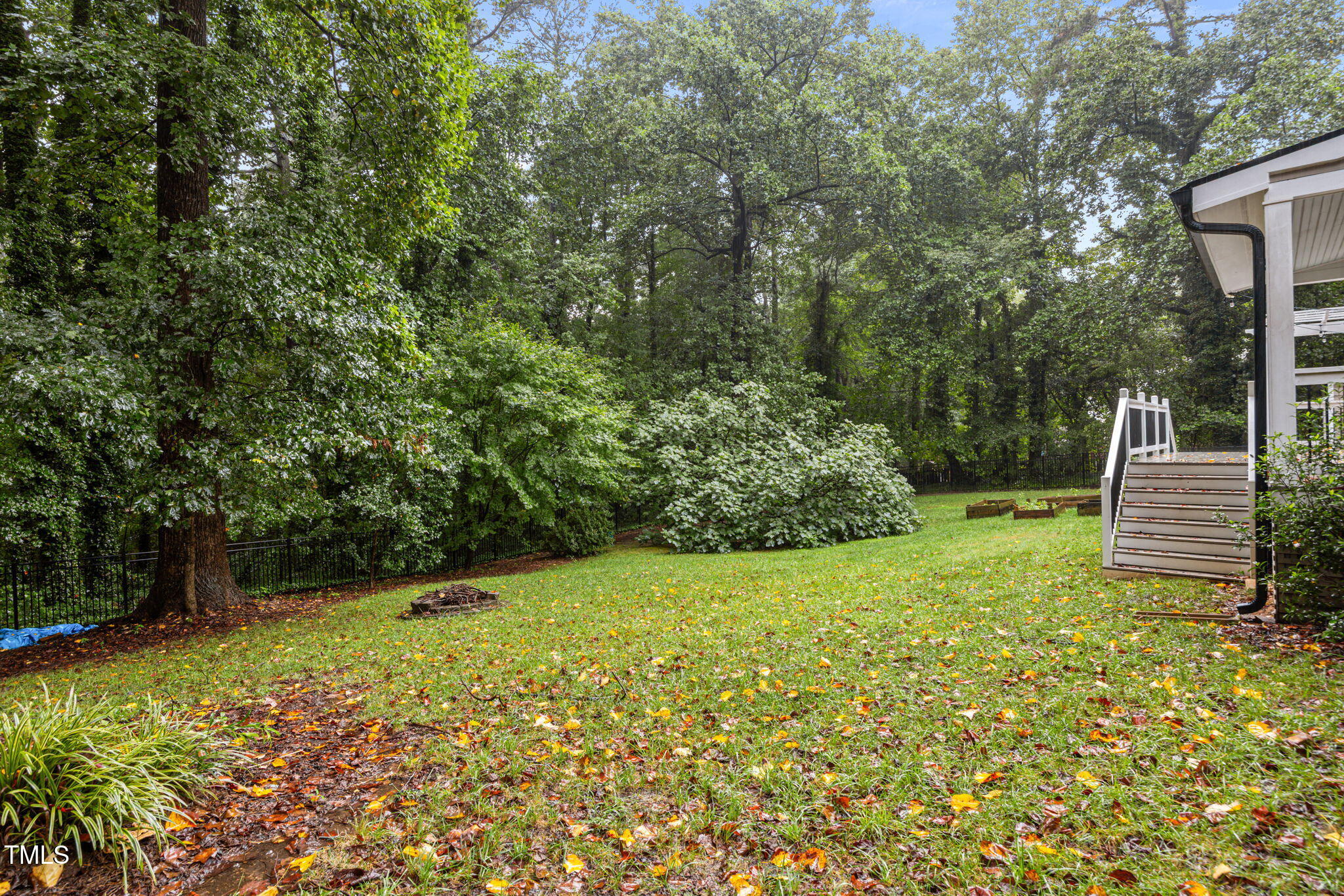 2204 Corberrie Lane Raleigh, NC 27613 - Photo 34 of 39 a view of a backyard with large trees