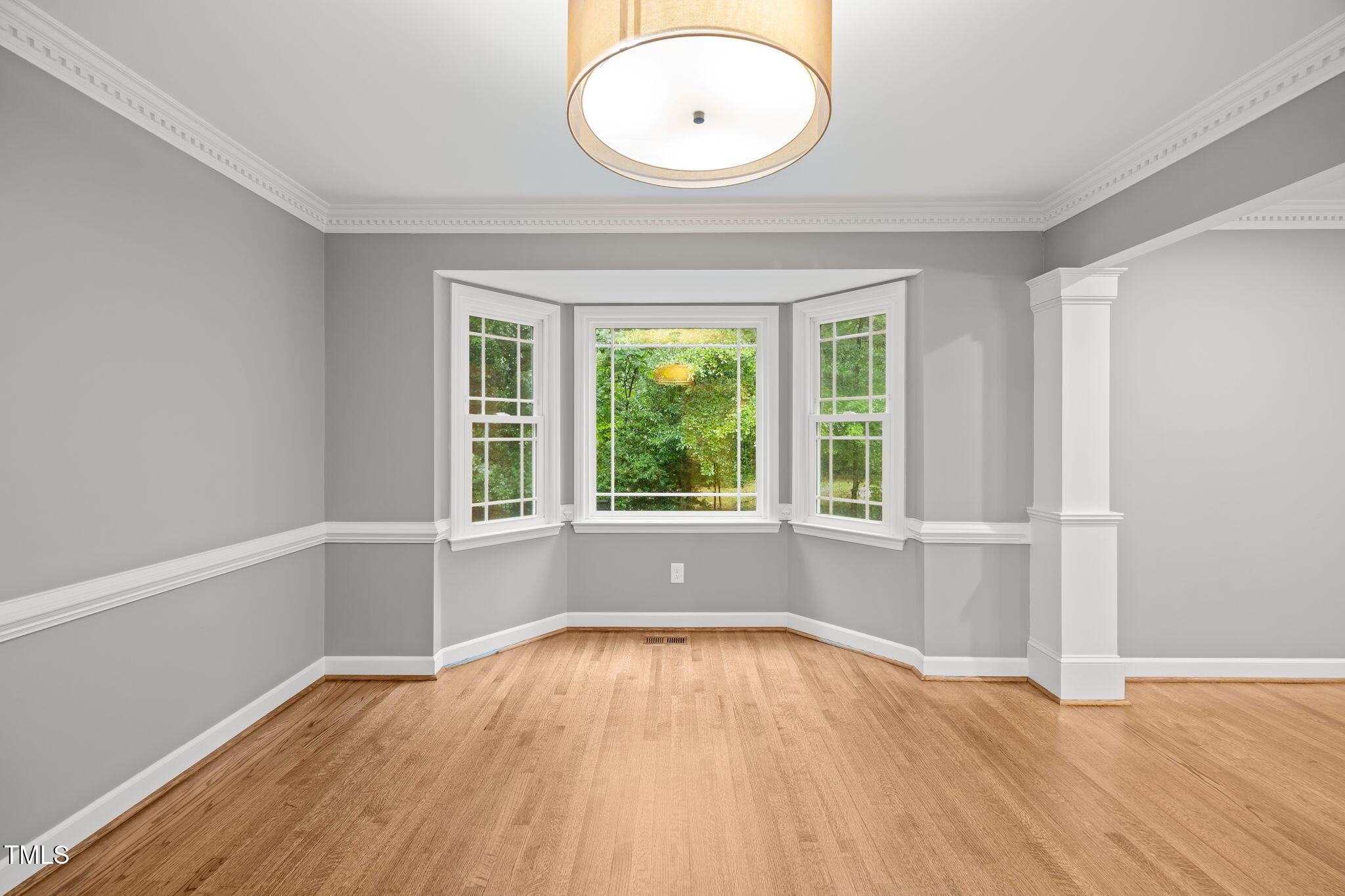 2204 Corberrie Lane Raleigh, NC 27613 - Photo 9 of 39 an empty room with wooden floor and windows