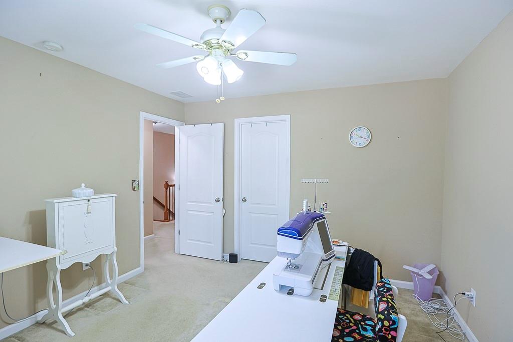 300 Hampton Place Canton, GA 30115 - Photo 46 of 82 a bed room with a bed and a chandelier