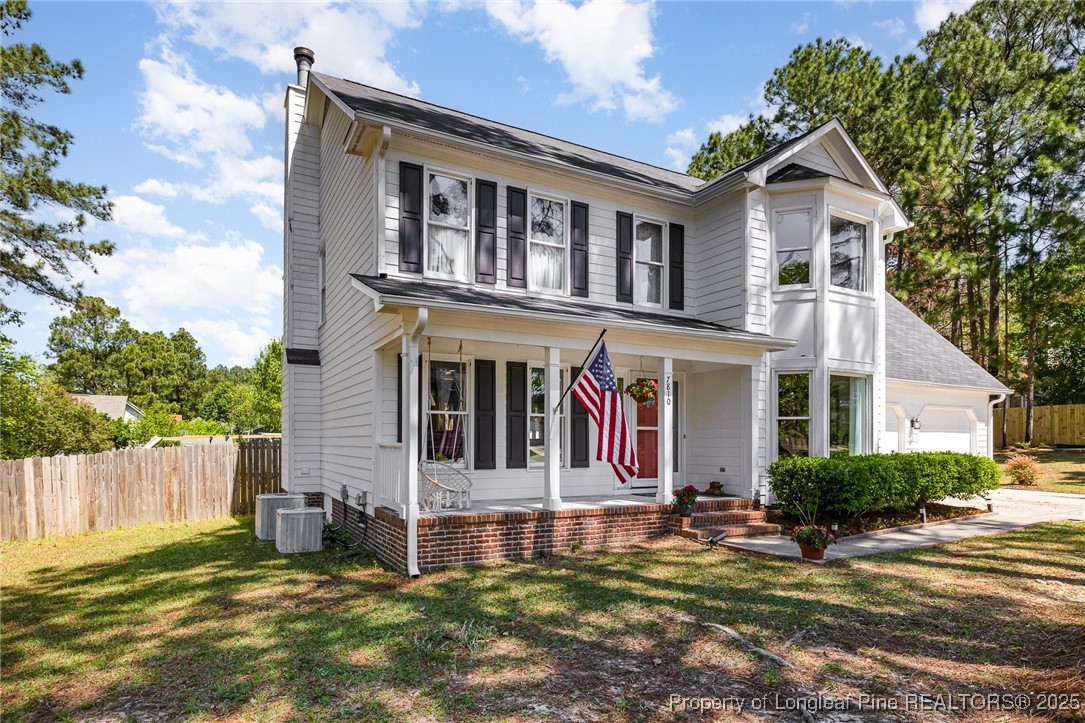 7810 Shuttle Road Fayetteville, NC 28311 - Photo 2 of 25 front view of a house with a yard