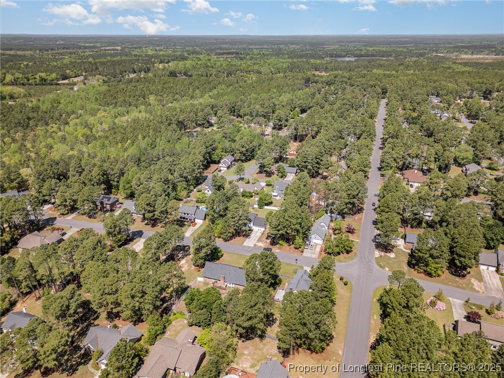7810 Shuttle Road Fayetteville, NC 28311 - Photo 23 of 25 an aerial view of residential houses with outdoor space and trees