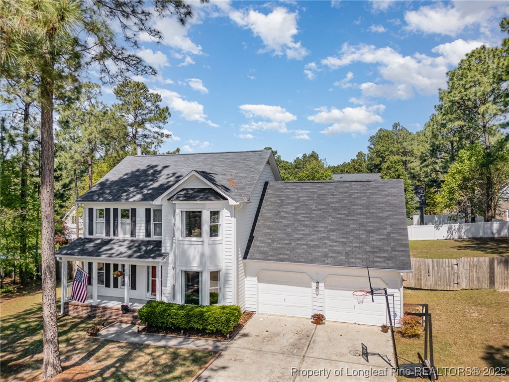 7810 Shuttle Road Fayetteville, NC 28311 - Photo 3 of 25 a front view of a house with a garden