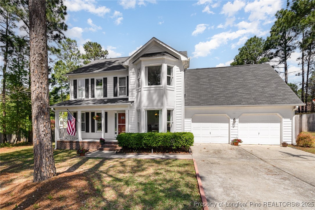7810 Shuttle Road Fayetteville, NC 28311 - Photo 4 of 25 a front view of a house with a yard