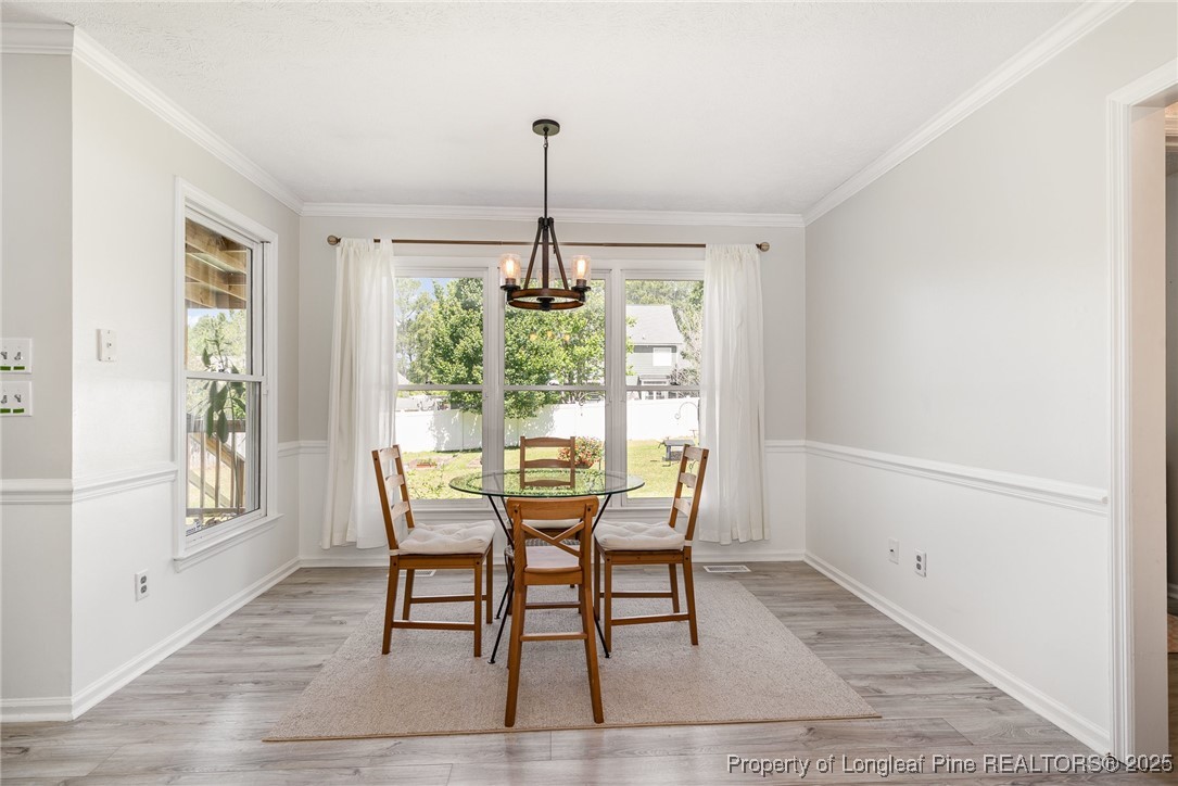 7810 Shuttle Road Fayetteville, NC 28311 - Photo 8 of 25 a dining room with furniture and window